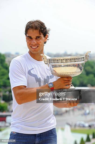 Rafael Nadal of Spain poses with the Coupe des Mousquetaires trophy in front of the Eiffel Tower after his victory against Novak Djokovic of Serbia...