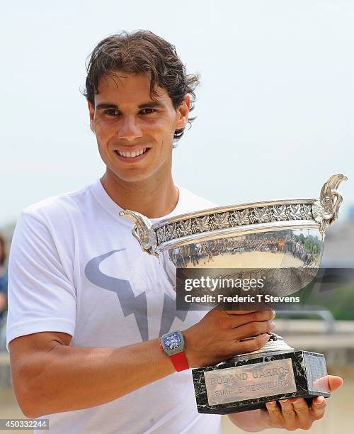 Rafael Nadal of Spain poses with the Coupe des Mousquetaires trophy in front of the Eiffel Tower after his victory against Novak Djokovic of Serbia...