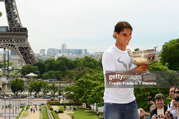 Rafael Nadal of Spain poses with the Coupe des Mousquetaires trophy in front of the Eiffel Tower after his victory against Novak Djokovic of Serbia...