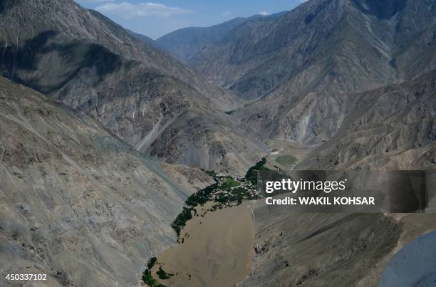 Mud from a landslide caused by flooding is seen in this aerial view of Afghanistan's Guzargah-e-Nur district of Baghlan province on June 9, 2014....