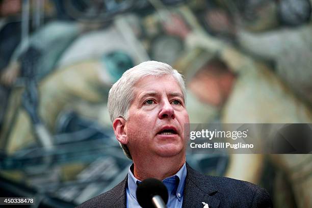 Michigan Gov. Rick Snyder speaks at a press conference at the Detroit Institute of Arts June 9, 2014 in Detroit, Michigan. Snyder and others...