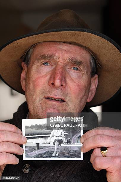 Irish writer John Pascal Rodgers, who was born in Tuam, County Galway, at home for unmarried mothers run by nuns, poses with a photograph of his...
