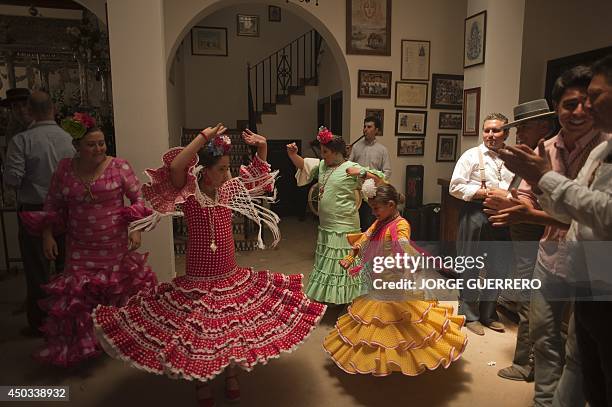 People dance in the village of El Rocio, southern Spain on June 9, 2014 during the annual pilgrimage. El Rocio pilgrimage is the largest in Spain...