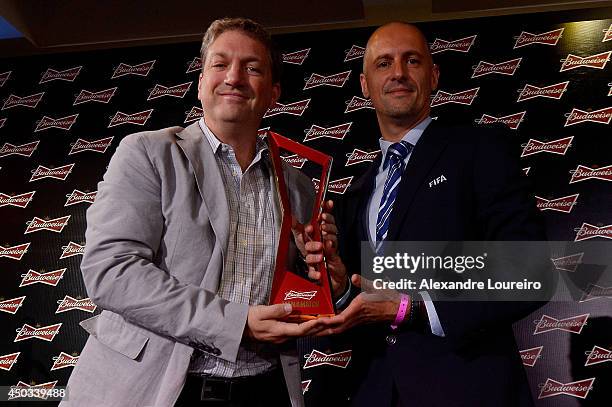 Andrew Sneyd, Global vice president of Budweiser and Jean Francois Pathy, representative of FIFA holds the FIFA man of the match trophy, during the...