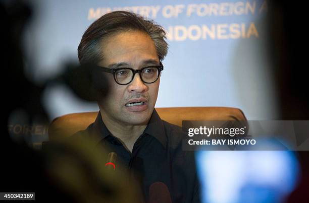 Indonesian Foreign Minister Marty Natalegawa delivers a statement in Jakarta on November 18, 2013. Indonesia on November 18 recalled its ambassador...