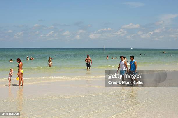 Hiroshi Kiyotake and Hotaru Yamaguchi are seen as they walk on Clearwater beach on June 6, 2014 in Clearwater, Florida.