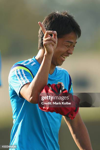 Hiroshi Kiyotake laughs as he takes part in a drill during a Japan training session at the Japan national team base camp at the Spa Sport Resort on...