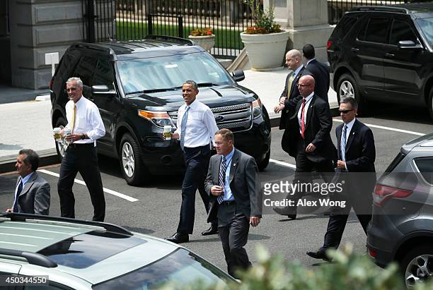 President Barack Obama returns to the White House after he went outside for a coffee with White House Chief of Staff Denis McDonough June 9, 2014 in...