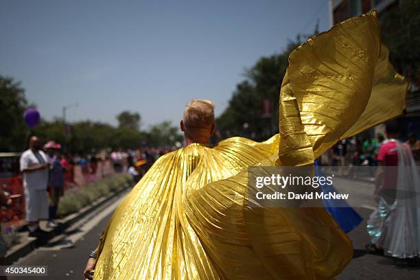 Man wears a golden cape in the LA Pride Parade on June 8, 2014 in West Hollywood, California. The LA Pride Parade and weekend events this year are...