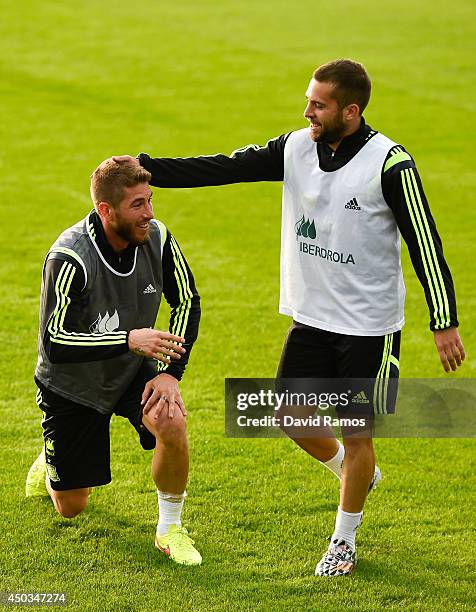 Sergio Ramos and Jordi Alba of Spain share a joke during a Spain training session at the Centro de Entrenamiento do Caju on June 9, 2014 in Curitiba,...