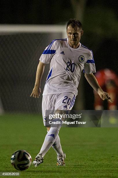 Izet Hajrovic of Bosnia passes the ball during a training session match against a Santos FC U-20 team at Municipal Antonio Fernandes Stadium on June...