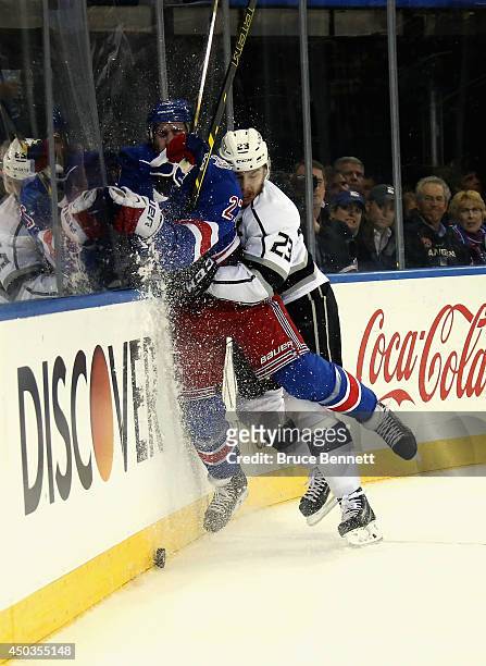 Dustin Brown of the Los Angeles Kings checks Ryan McDonagh of the New York Rangers during the first period of Game Three of the 2014 NHL Stanley Cup...