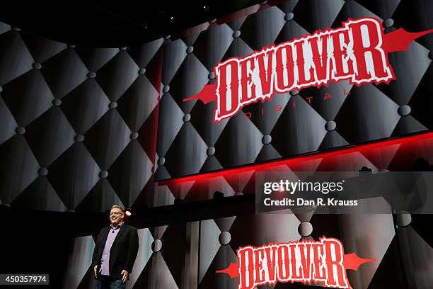 Adam Boyes, Sony VP, introduces Devolver during their press conference at E3 June 9, 2014 in Los Angeles, California. The annual video game...