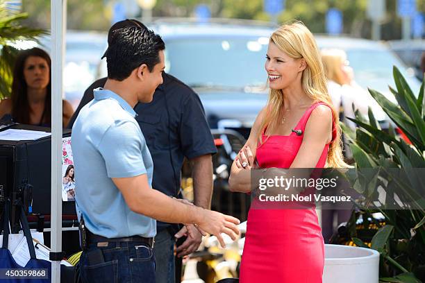 Beth Stern talks to Mario Lopez at "Extra" at Universal Studios Hollywood on June 9, 2014 in Universal City, California.