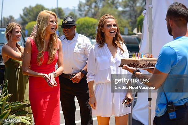 Maria Menounos is surprised by a birthday cake at "Extra" at Universal Studios Hollywood on June 9, 2014 in Universal City, California.