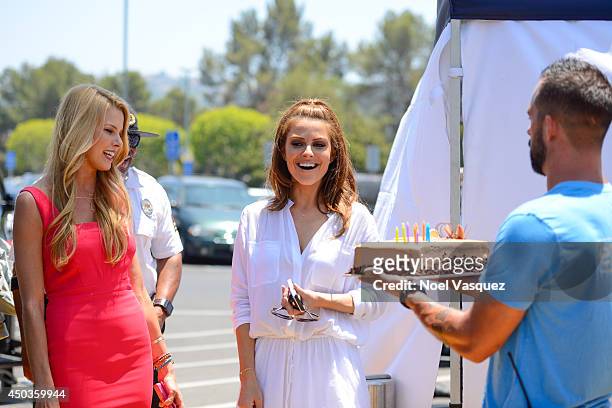 Maria Menounos is surprised by a birthday cake at "Extra" at Universal Studios Hollywood on June 9, 2014 in Universal City, California.