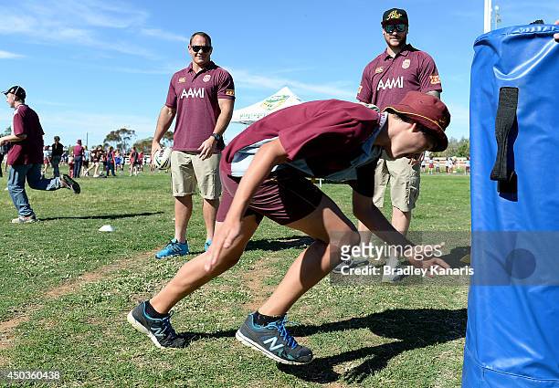 Matt Scott and Chris McQueen watch on at junior Rugby League clinic during the Queensland Maroons State of Origin visit to Longreach on June 10, 2014...