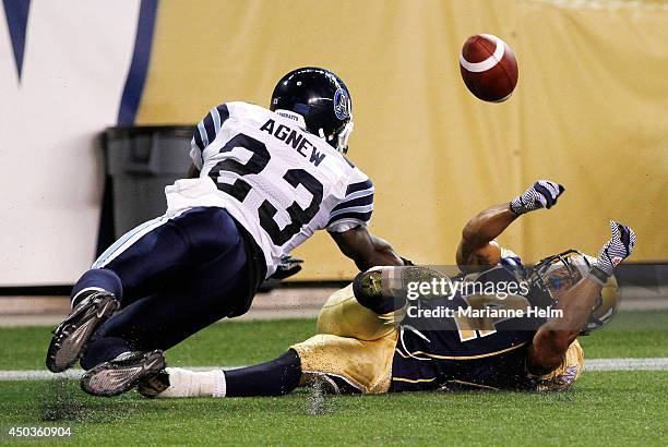 Aaron Woods of the Winnipeg Blue Bombers can't come up with the ball in the endzone as Vincent Agnew of the Toronto Argonauts defends in second-half...