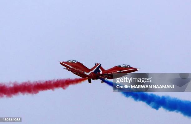 Britain's Royal Air Force Aerobatic Team, The Red Arrows, performs during the Dubai Airshow on November 18 in Dubai. Emirates Airline's appetite for...