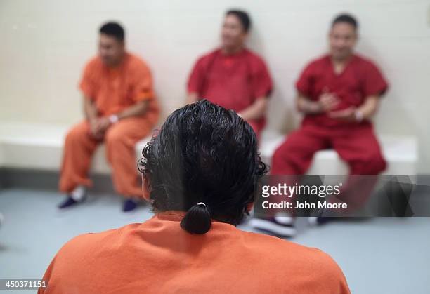 Immigrants wait for medical attention during 'sick call' at the Adelanto Detention Facility on November 15, 2013 in Adelanto, California. The center,...