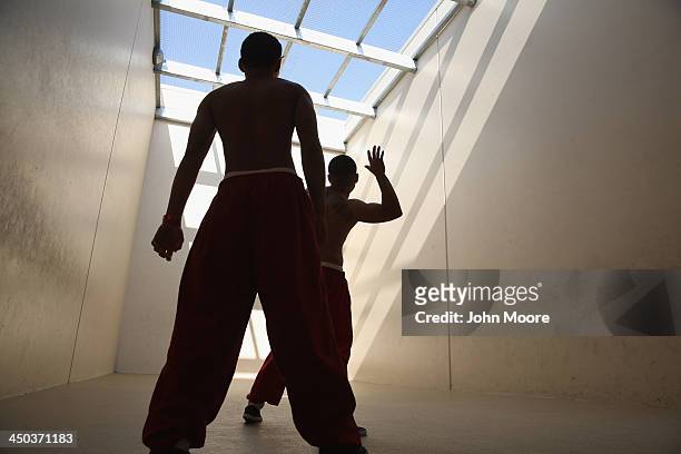 Immigrant detainees play handball at the Adelanto Detention Facility on November 15, 2013 in Adelanto, California. The facility, the largest and...