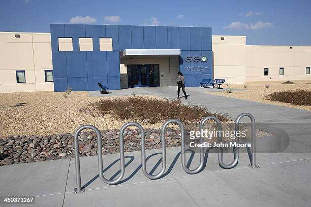 Family member walks into the Adelanto Detention Facility on November 15, 2013 in Adelanto, California. The facility, the largest and newest...