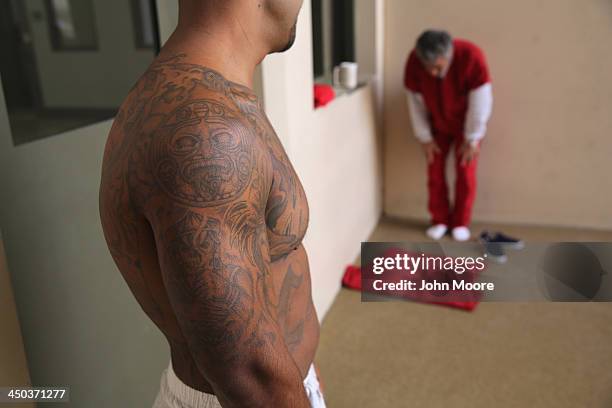 Muslim immigrant detainee from Iran , prays at the Adelanto Detention Facility on November 15, 2013 in Adelanto, California. The facility, the...