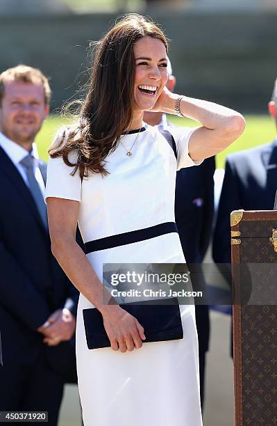 Catherine, Duchess of Cambridge poses next to the America's Cup as she visits the National Maritime Museum in Greenwich for the Ben Ainslie America's...