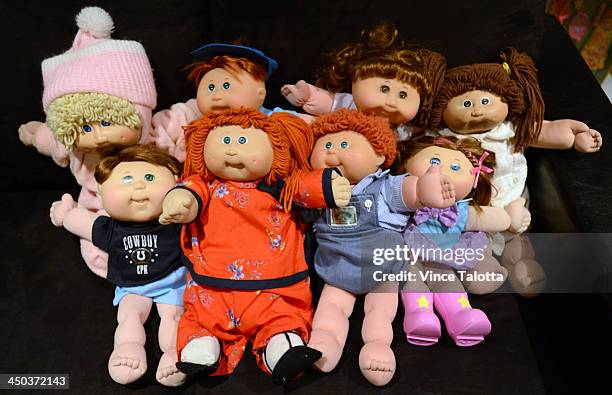 Alana and her husband David Silber with their children surround themselves with Cabbage Patch dolls and Barbie dolls that Alana has been collecting...