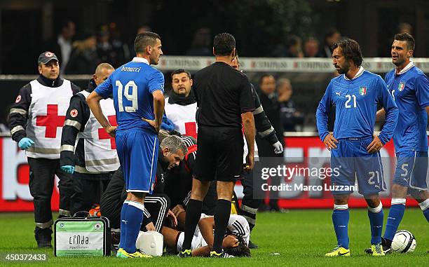 Sami Khedira of Germany lies injured during the international friendly match between Italy and Germany at Giuseppe Meazza Stadium on November 15,...