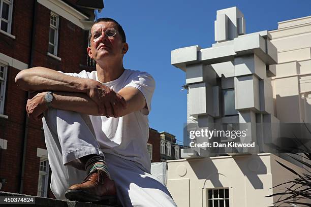 British Artist Anthony Gormley poses for a photograph in front of a new piece of work entitled 'Room' on June 10, 2014 in London, England. Mr...