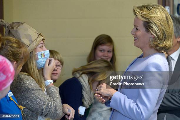 Queen Mathilde of Belgium attends a reading session with children suffering from cancer at the UZ Hospital on November 18, 2013 in Leuven, Belgium.