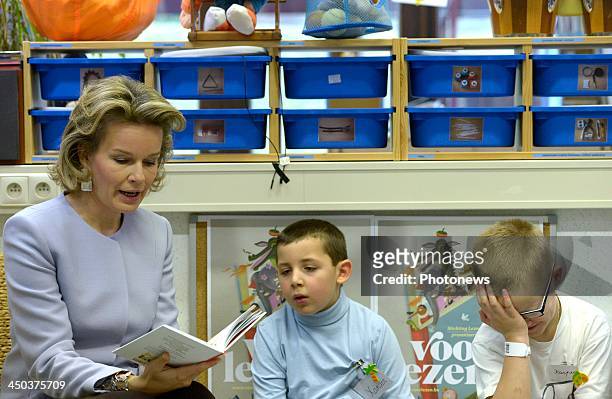 Queen Mathilde of Belgium attends a reading session with children suffering from cancer at the UZ Hospital on November 18, 2013 in Leuven, Belgium.