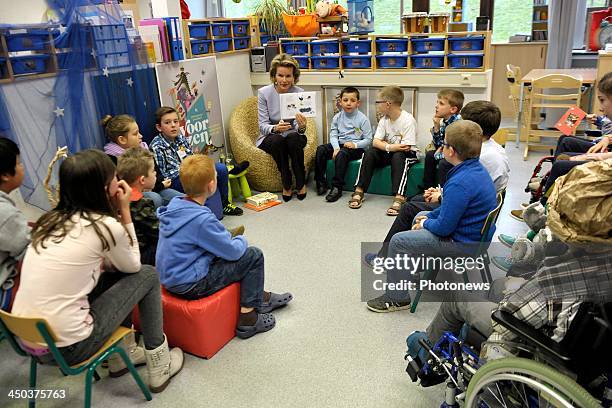 Queen Mathilde of Belgium attends a reading session with children suffering from cancer at the UZ Hospital on November 18, 2013 in Leuven, Belgium.