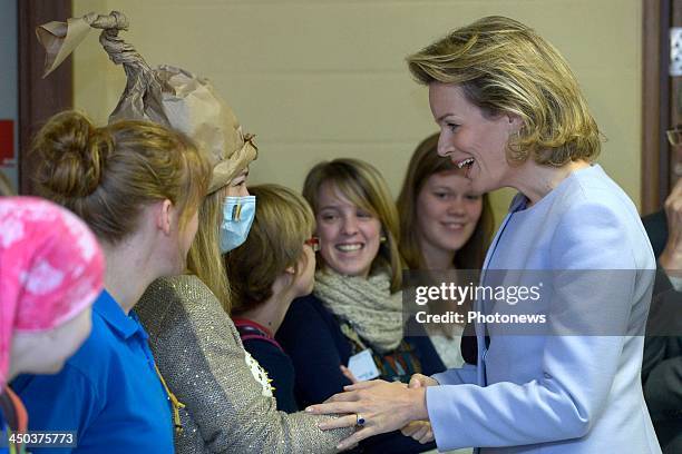 Queen Mathilde of Belgium attends a reading session with children suffering from cancer at the UZ Hospital on November 18, 2013 in Leuven, Belgium.