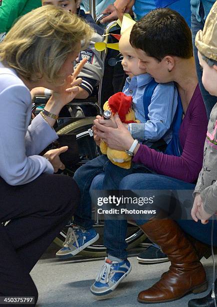 Queen Mathilde of Belgium attends a reading session with children suffering from cancer at the UZ Hospital on November 18, 2013 in Leuven, Belgium.