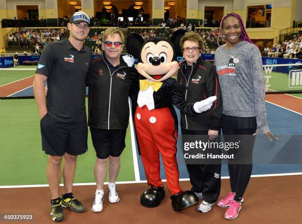 In this handout photo provided by Disney Parks, Tennis star Andy Roddick, entertainer Sir Elton John, tennis legend Billie Jean King and women's...