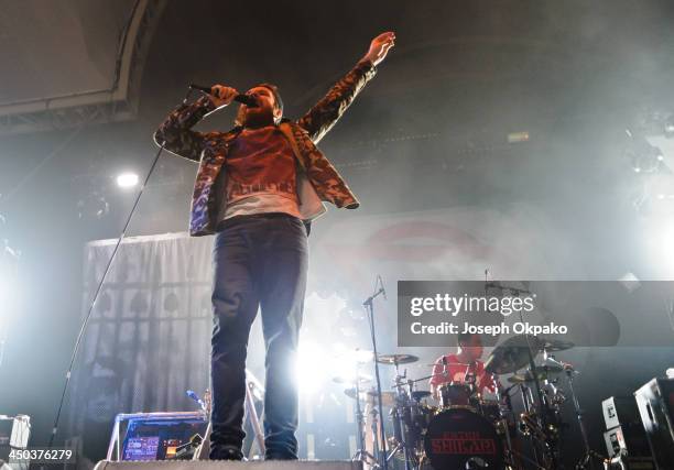 Rou Reynolds and Rob Rolfe of Enter Shikari performs on stage during Vans Warped Tour 2013 at Alexandra Palace on November 17, 2013 in London, United...