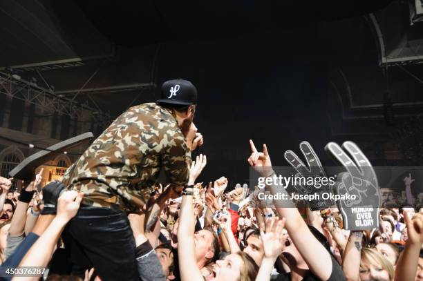 Rou Reynolds of Enter Shikari performs on stage during Vans Warped Tour 2013 at Alexandra Palace on November 17, 2013 in London, United Kingdom.