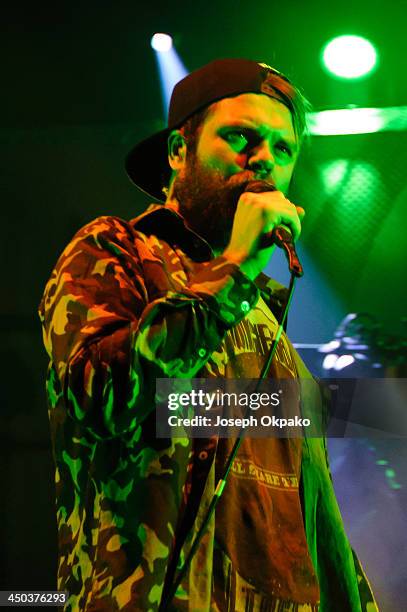 Rou Reynolds of Enter Shikari performs on stage during Vans Warped Tour 2013 at Alexandra Palace on November 17, 2013 in London, United Kingdom.