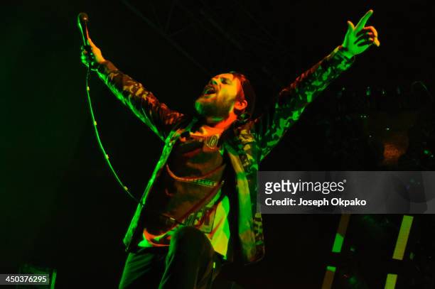 Rou Reynolds of Enter Shikari performs on stage during Vans Warped Tour 2013 at Alexandra Palace on November 17, 2013 in London, United Kingdom.
