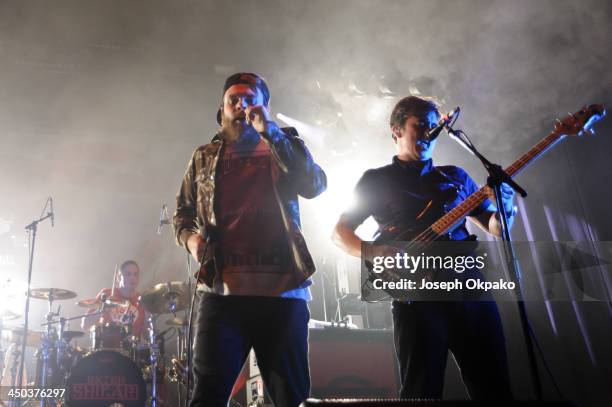 Rob Rolfe, Rou Reynolds and Chris Batten of Enter Shikari performs on stage during Vans Warped Tour 2013 at Alexandra Palace on November 17, 2013 in...