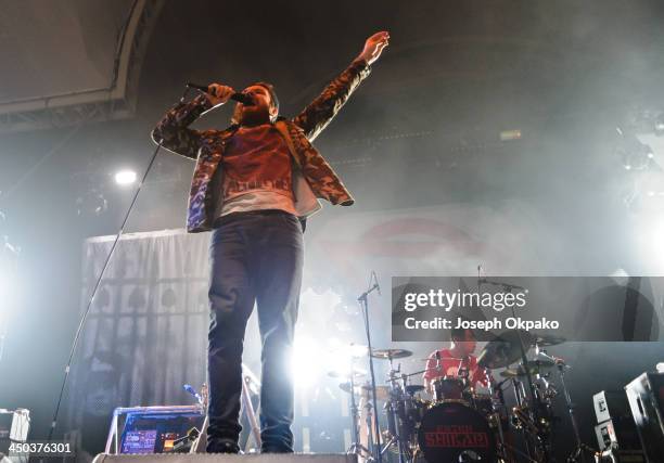 Rou Reynolds and Rob Rolfe of Enter Shikari performs on stage during Vans Warped Tour 2013 at Alexandra Palace on November 17, 2013 in London, United...