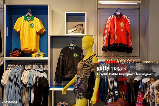 Replica classic football shirts of the Spain 1982 and of the Brazil football teams are on sale at classic clothes retailer store on June 10, 2014 in...