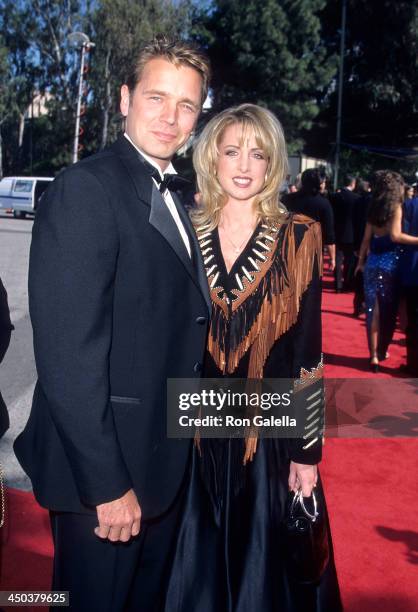 Actor John Schneider and wife Elly Castle attend the 34th Annual Academy of Country Music Awards on May 5, 1999 at the Universal Amphitheatre in...