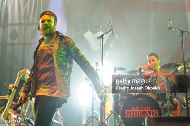 Rou Reynolds and Rob Rolfe of Enter Shikari performs on stage during Vans Warped Tour 2013 at Alexandra Palace on November 17, 2013 in London, United...