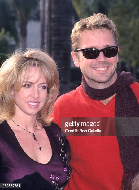 Actor John Schneider and wife Elly Castle attend the "Snow Day" Hollywood Premiere on January 29, 2000 at Paramount Theatre, Paramount Pictures...