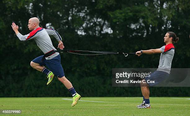 Michael Bradley and Graham Zusi of the United States work out during their training session at Sao Paulo FC on June 10, 2014 in Sao Paulo, Brazil.