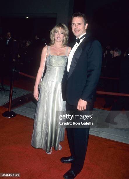 Actor John Schneider and wife Elly Castle attend the 12th Annual Palm Springs International Film Festival on January 13, 2001 at the Palm Springs...