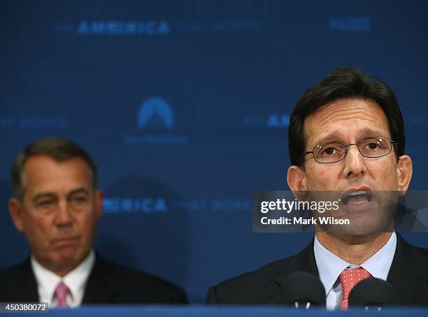 House Majority Leader Eric Cantor speaks while flanked by House Speaker John Boehner during a news conference at the U.S. Capitol June 10, 2014 in...